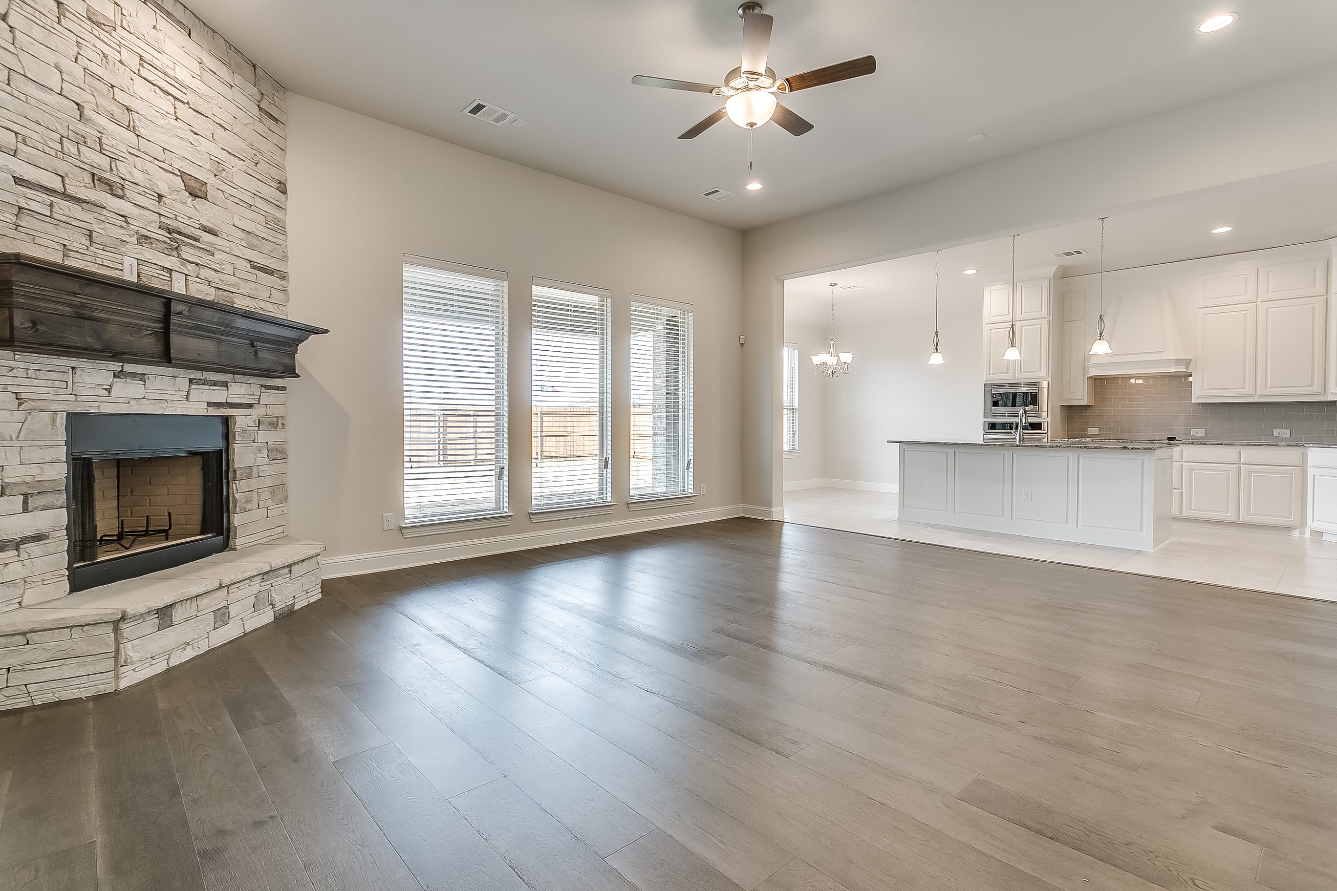 1113 Autumn Trail - John Houston Custom Homes - Fireplace, Living Room, Kitchen, Wood Floors